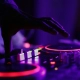 Tailoring Your Wedding Playlist: Music That Appeals to All Ages 3 hand on mixer board