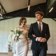 happy bride in white dress and groom in black suit