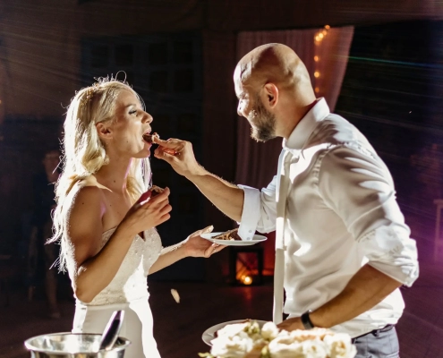bride and groom eating and feeding each other