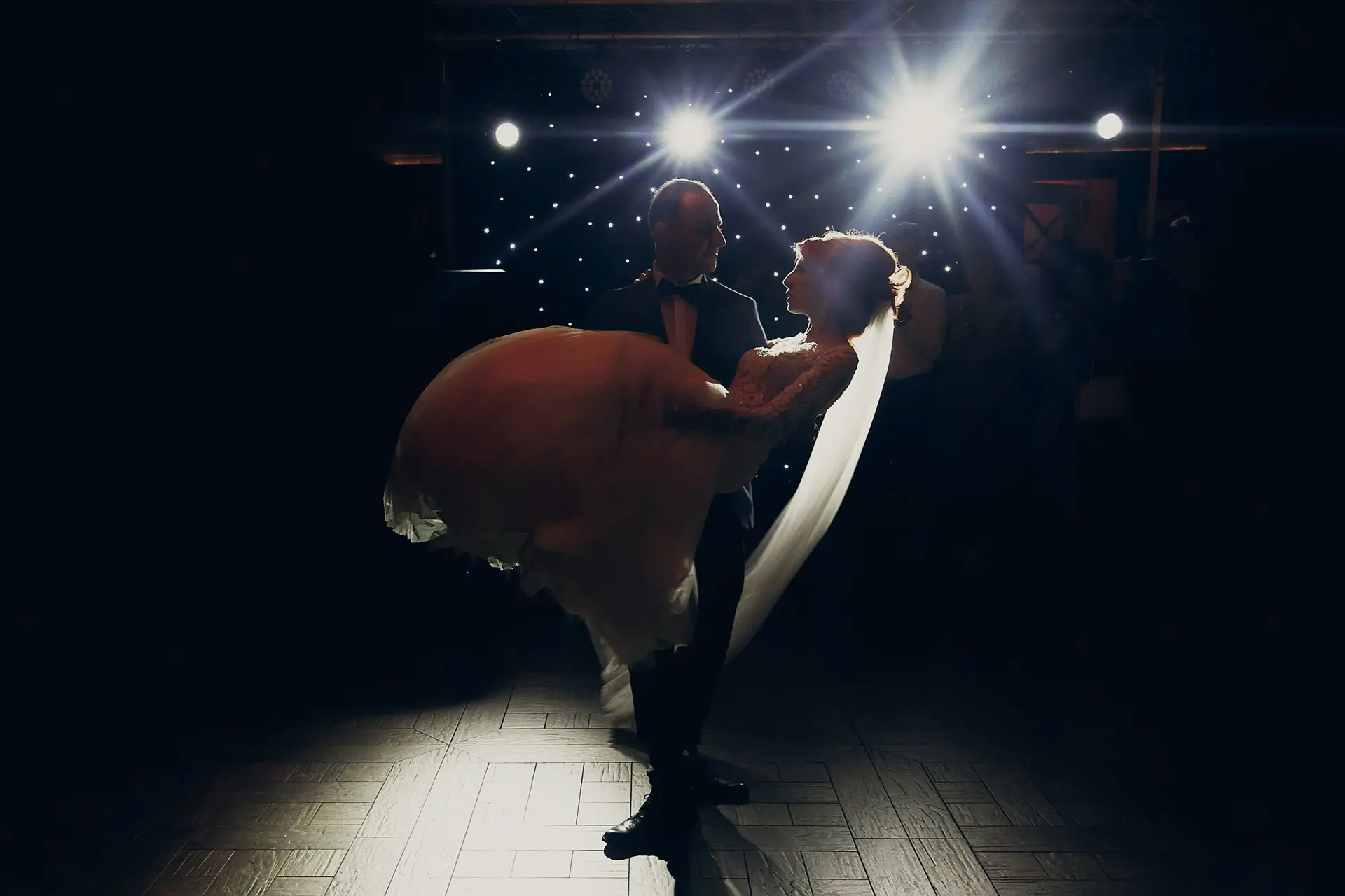 stylish happy bride and groom having fun in a limo