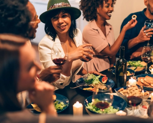 Diverse friends enjoying dinner and conversation