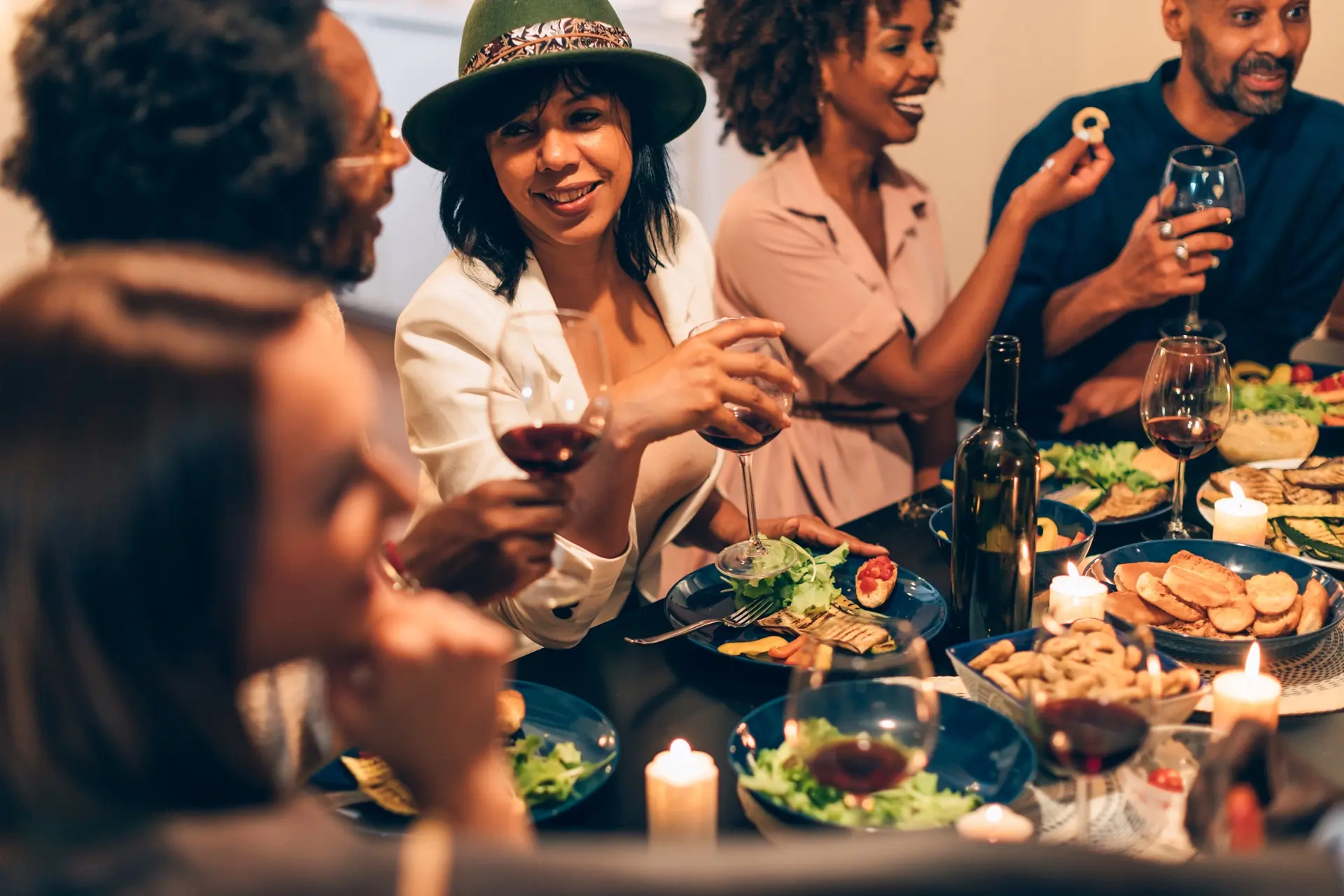 Diverse friends enjoying dinner and conversation