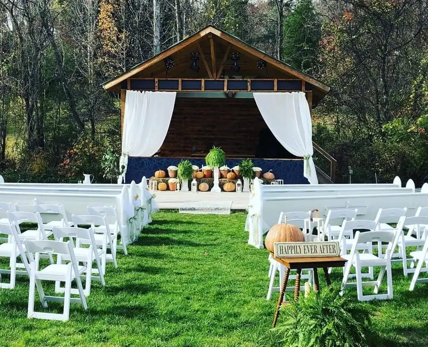Outdoor fall wedding ceremony with aisle seating and clear ceremony audio for vows in Winston-Salem.
