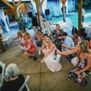 Wedding guests dancing together on a lively reception dance floor in Winston-Salem.